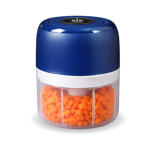 Blue baby food maker with transparent container filled with finely diced orange vegetables.