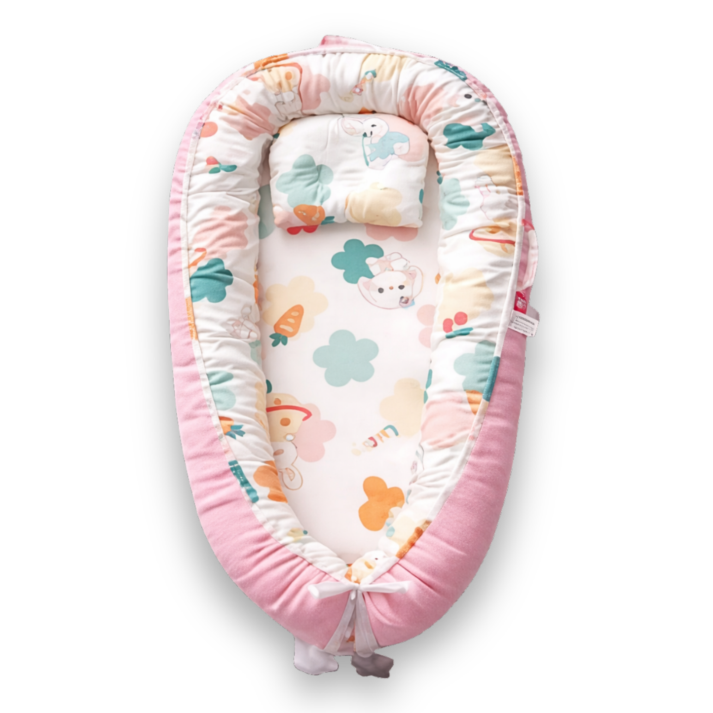 Pink baby lounger with colorful animal and clover print on white interior, viewed from above.