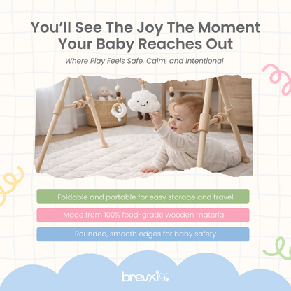 Baby lying on a soft mat reaching for cloud toy hanging from a wooden baby gym frame.