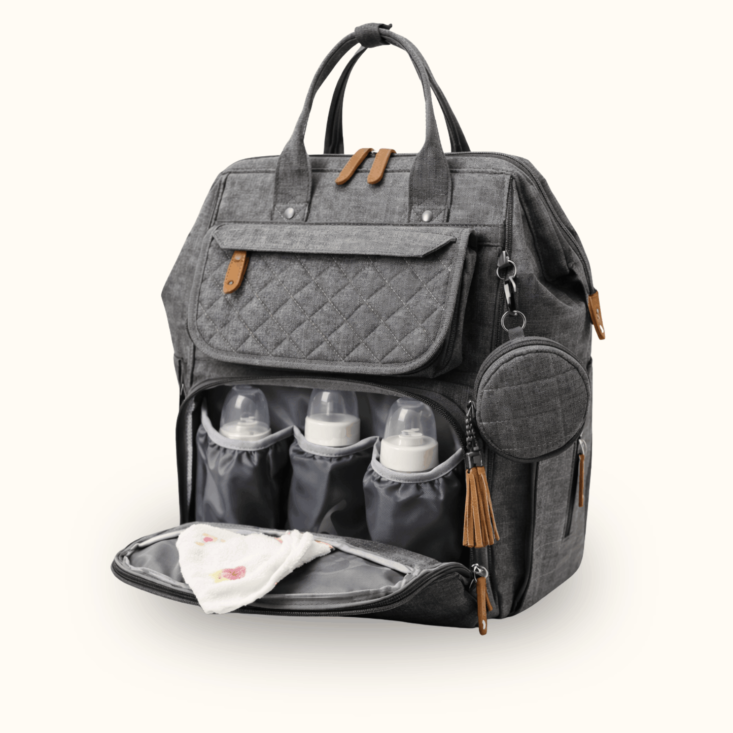 Grey quilted diaper bag with front compartment open, showing baby bottles and a folded cloth.