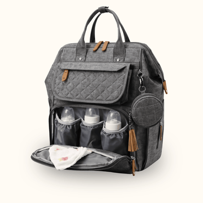 Grey quilted diaper bag with front compartment open, showing baby bottles and a folded cloth.