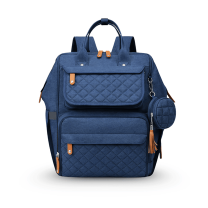 Navy blue quilted diaper bag with tan accents, shown from the front with multiple pockets and a round pouch.