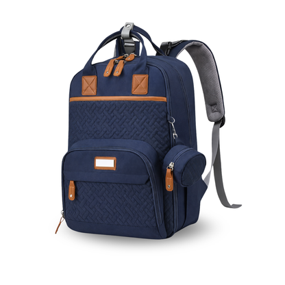 Navy blue diaper backpack with woven texture, brown leather accents, and attached round side pouch.