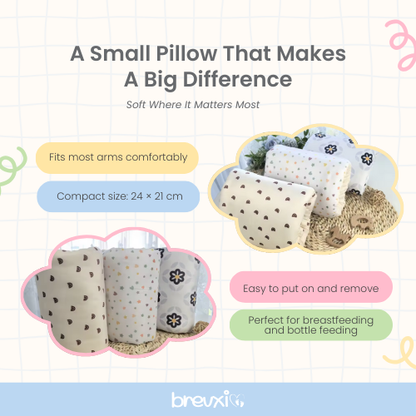 Set of small nursing pillows in different patterns and colors displayed on a soft surface.