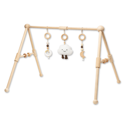 Wooden baby gym with three hanging toys including a soft cloud, moon, and beaded rings.