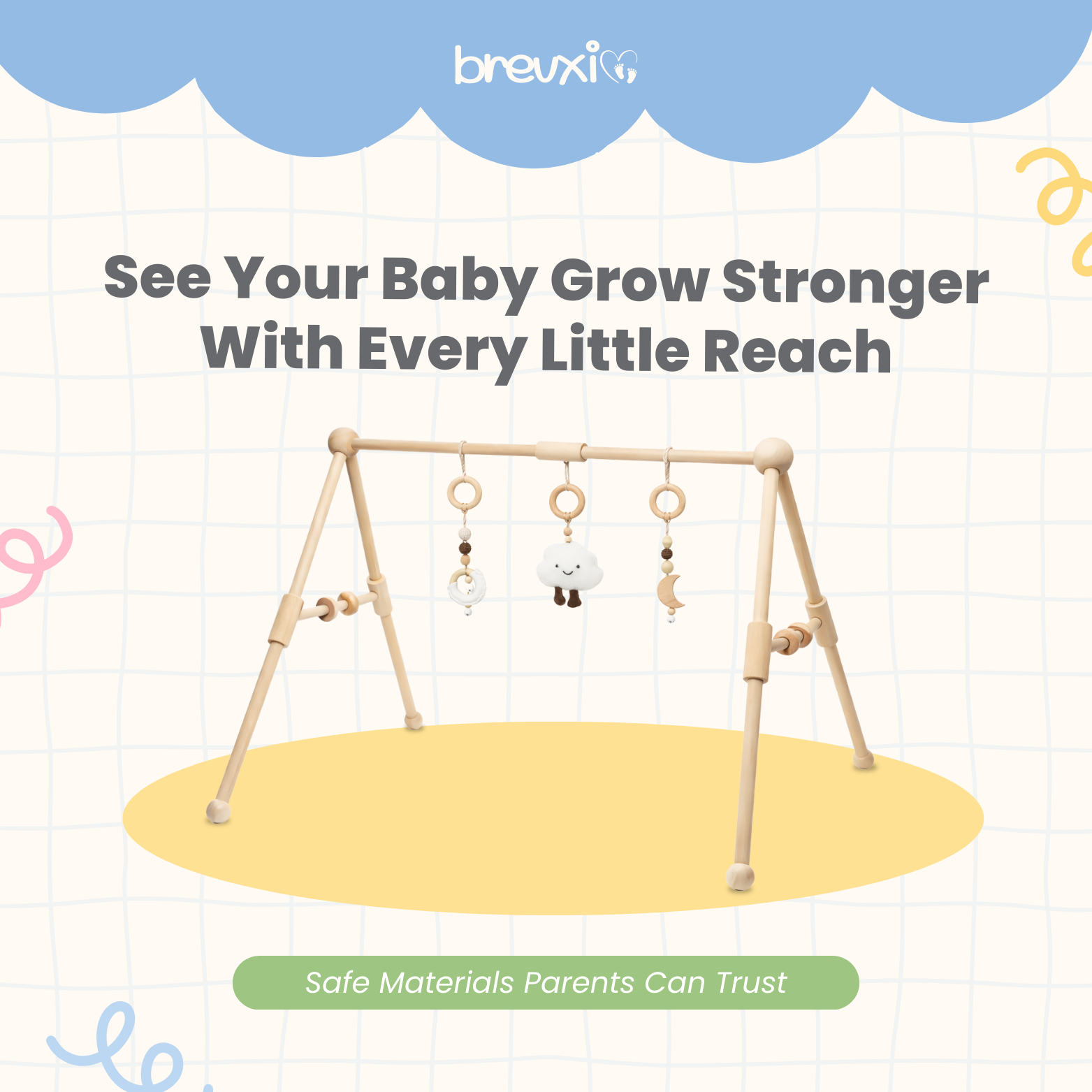 Wooden baby gym with cloud, moon, and ring toys hanging, displayed on a soft graphic background.
